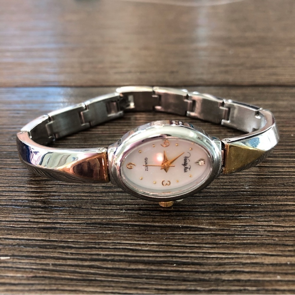 Sliver and gold linked bracelet watch